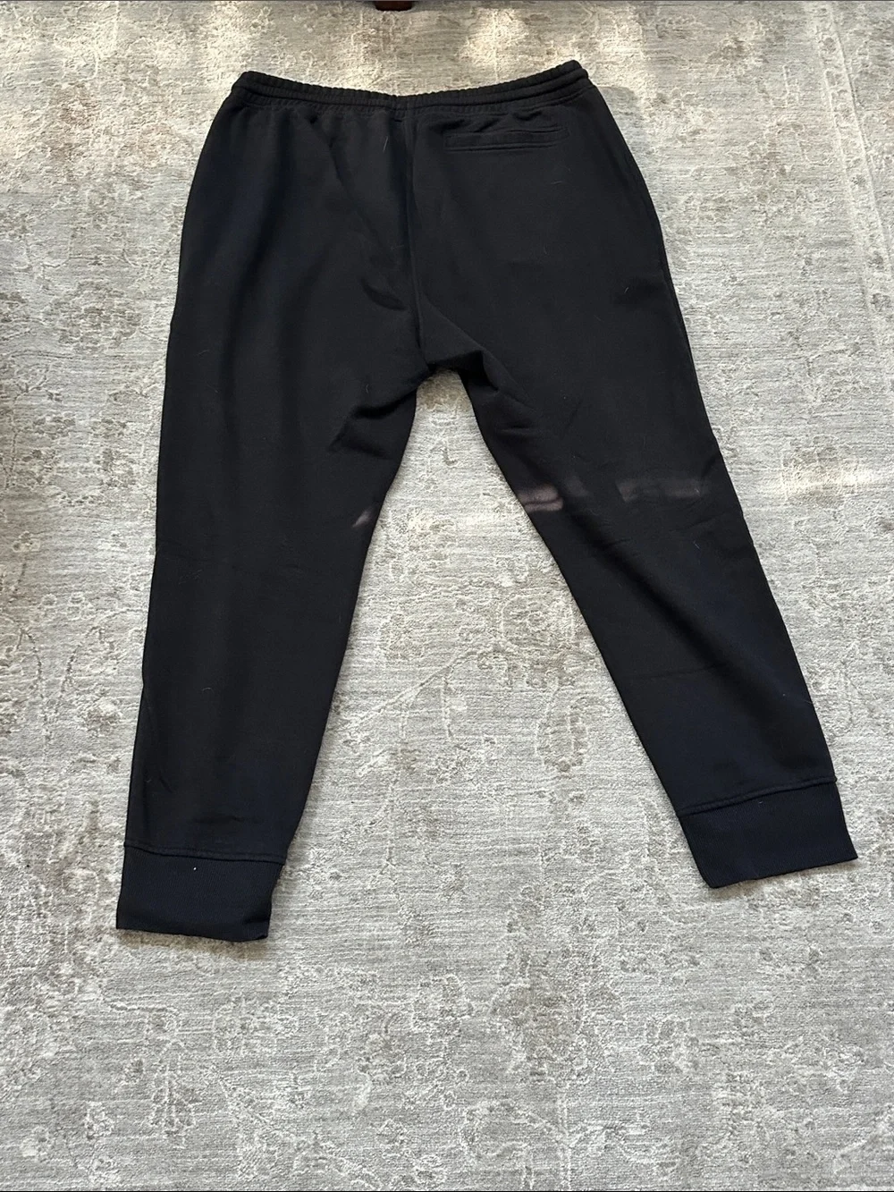 The North Face Men’s Large duo of one gray sweatpants and one black jogger.